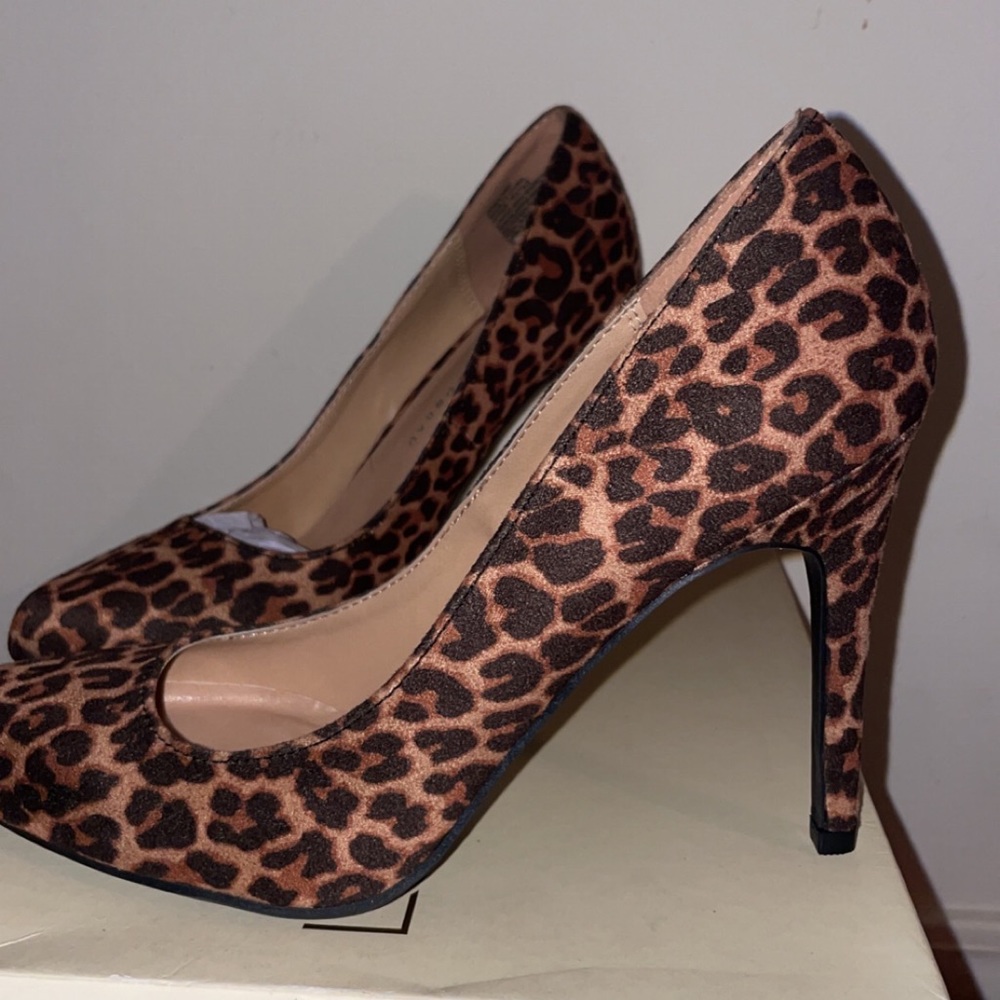 Never worn, brand new cheeta print heels!!